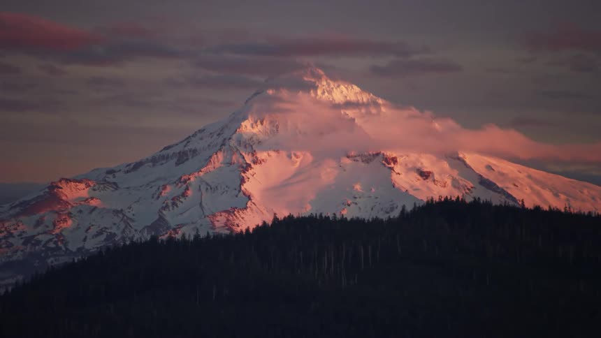 Mount Hood basking in golden sunlight at the end of a winter day deep in the PNW on Valentines Day