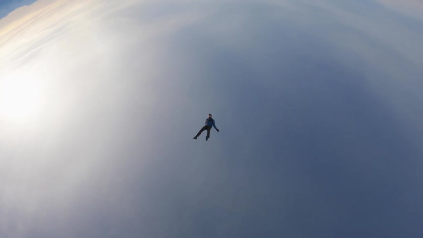 Skydiver is free falling in the sky