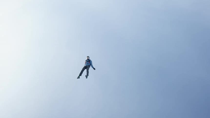 A skydiver floats as he falls before opening his parachute