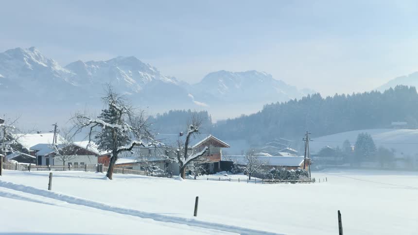 Snow surrounded the small town on a foggy day