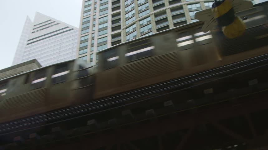 A train is driving through a downtown city