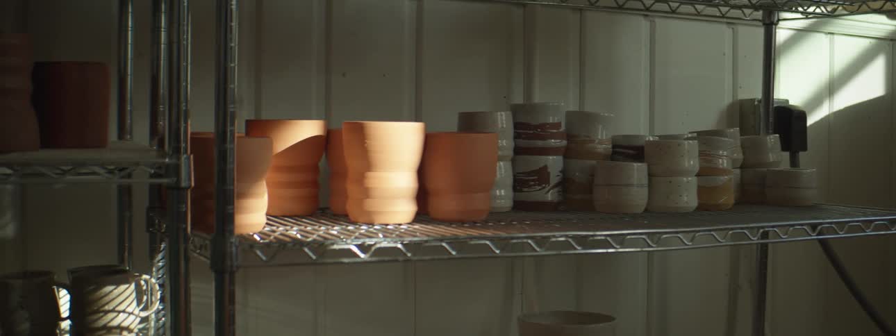 Pottery sitting on a shelf in a store