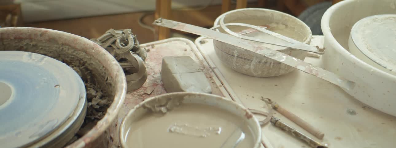 Paint and ceramics supplies on a table