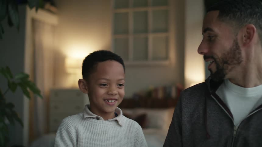 A father and son talking at home