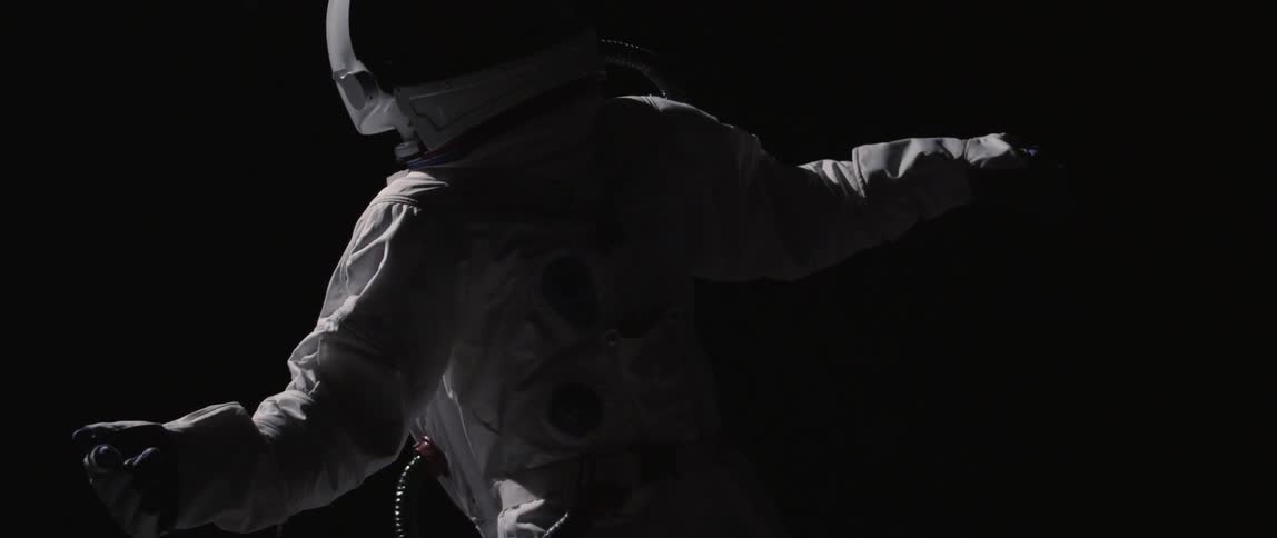An astronaut floats in space