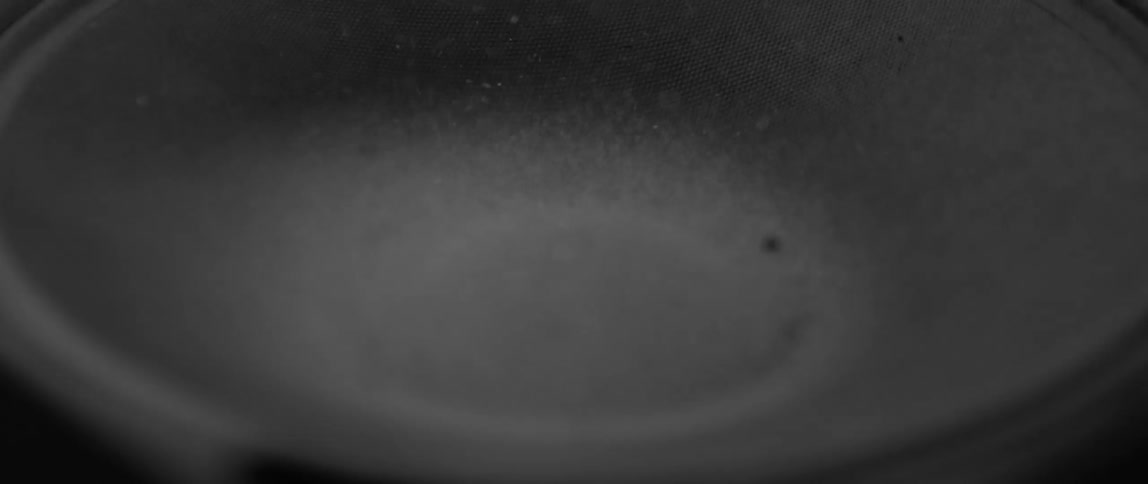 Sand jumps on a moving speaker