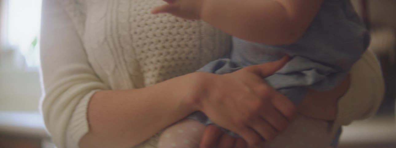 A mother holding a baby