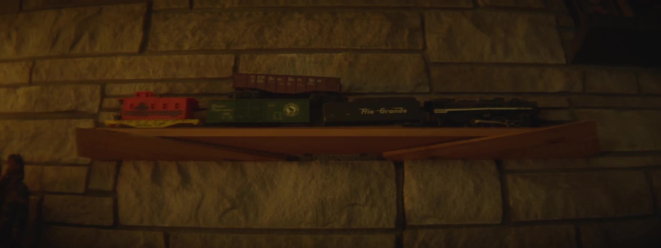 Equipment sitting on a wood shelf against a brick wall