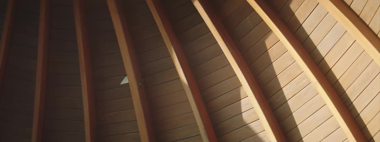 Light is shining on a ceiling of a room
