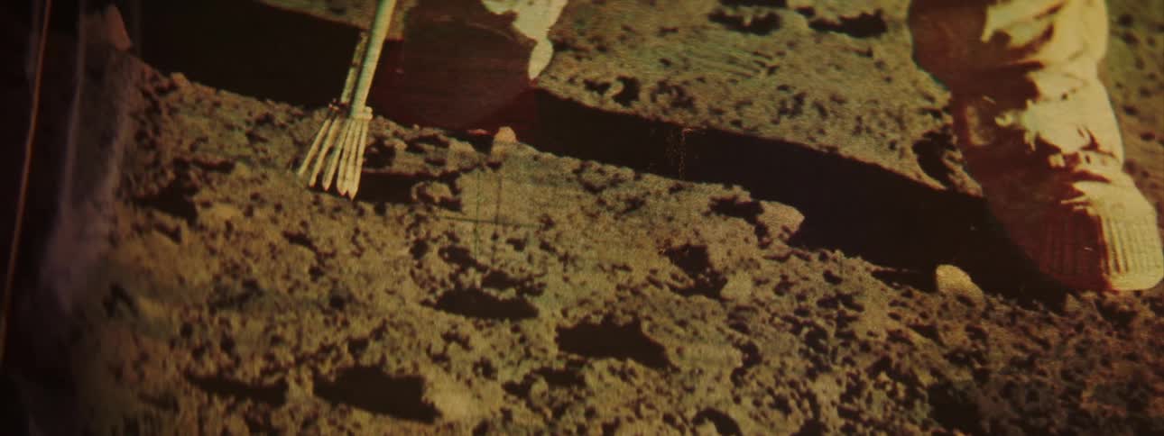 A picture of an astronaut standing on another planet is framed indoors