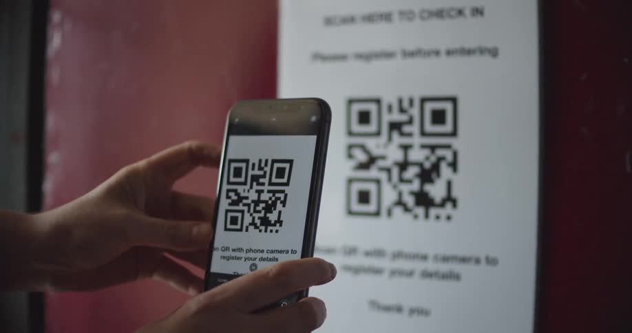 A person scans a qr code with their phone