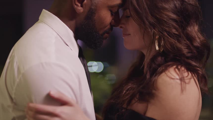 Husband and wife are dancing together at night