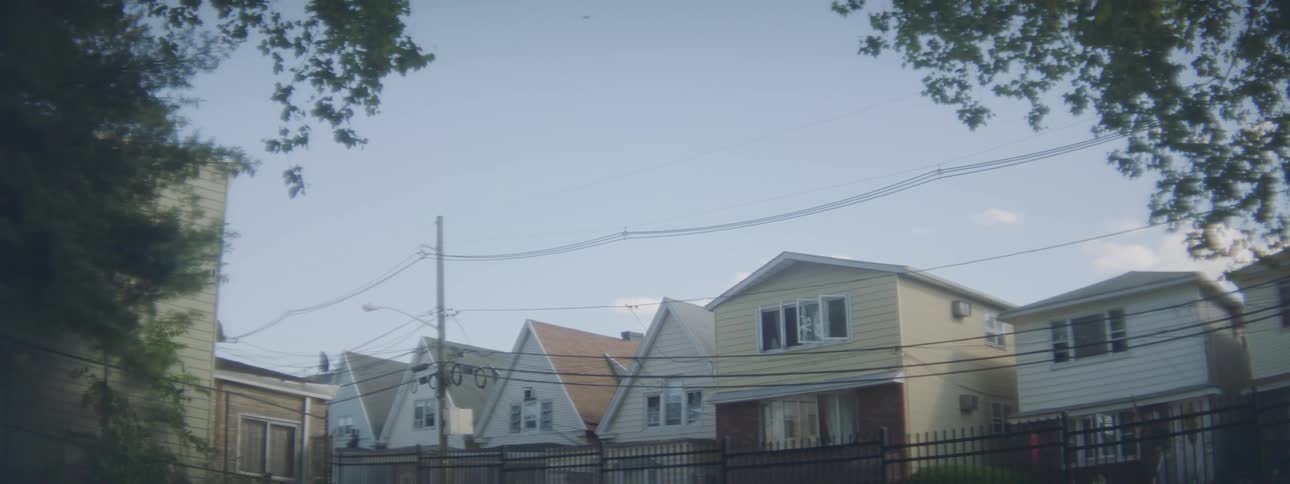 Houses in the neighborhood at daytime under a clear blue sky