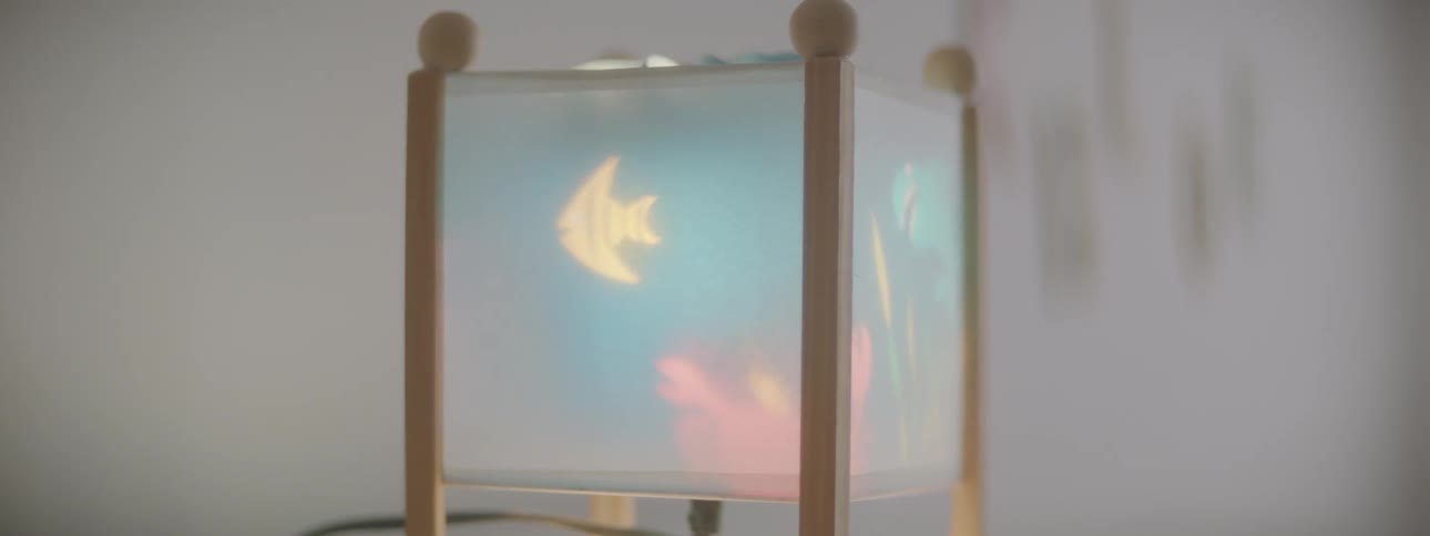 A box with a wire with light projecting on the sides