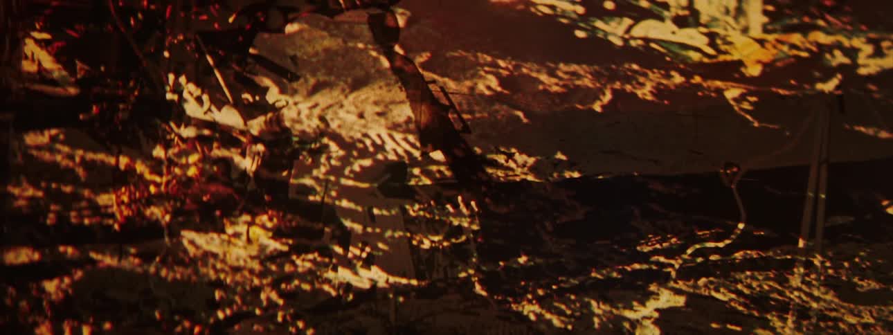 Abstract chaotic patterns of gold and yellow lines and dots over a surface
