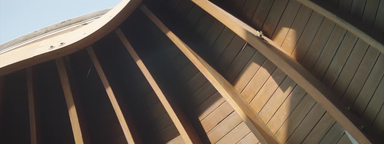 Wood beams on a wooden structure in daylight