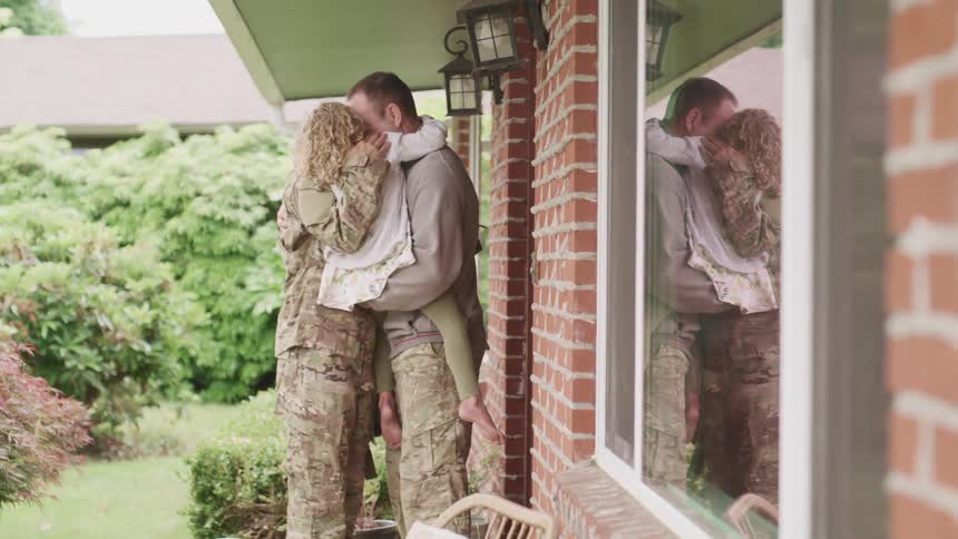 A military family being reunited after a deployment