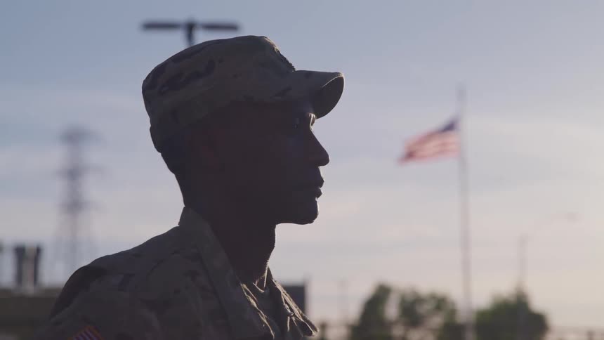A soldier stands at ease