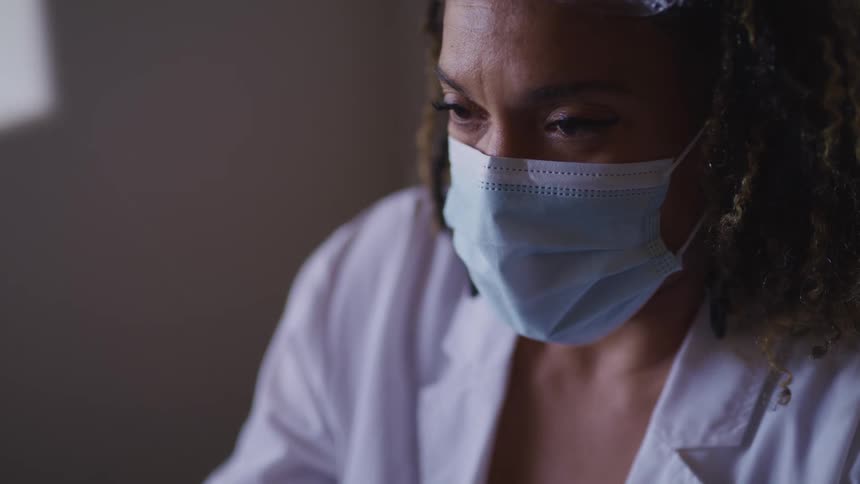 A doctor looking at something they are working on