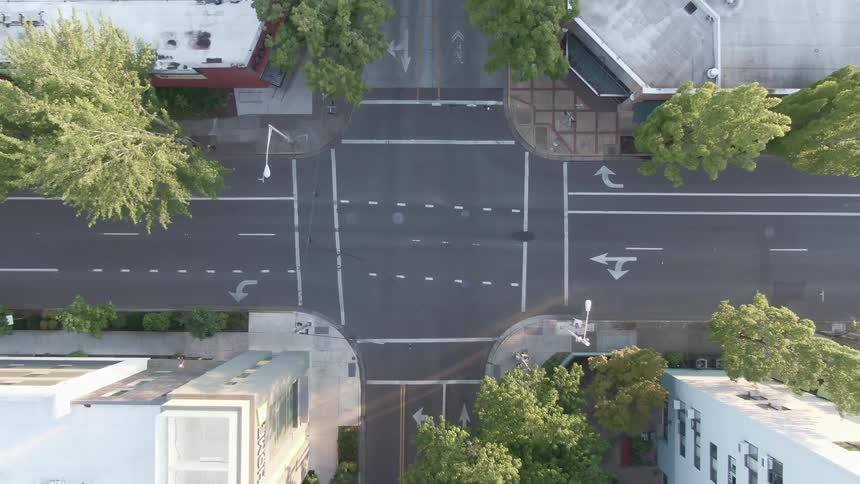 Tall apartment buildings sit at the corners of an intersection