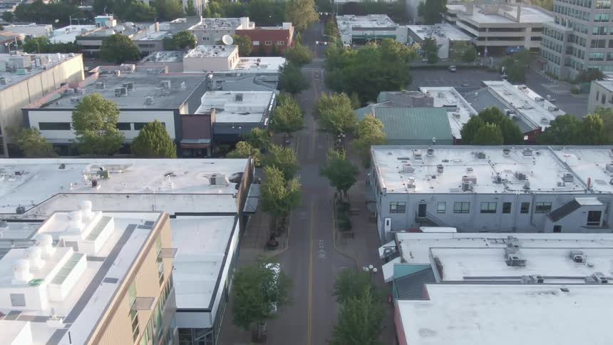 An aerial view of a offices and stores in a city
