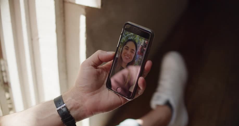 Two people talk over video on the phone