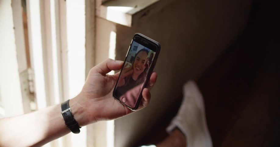A woman talking on a smartphone with video features