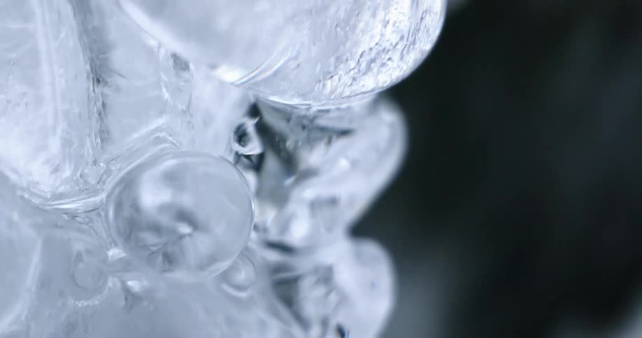 A waterfall with ice melting