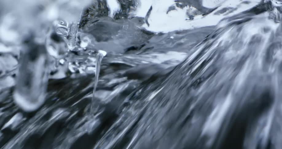 A waterfall with ice melting