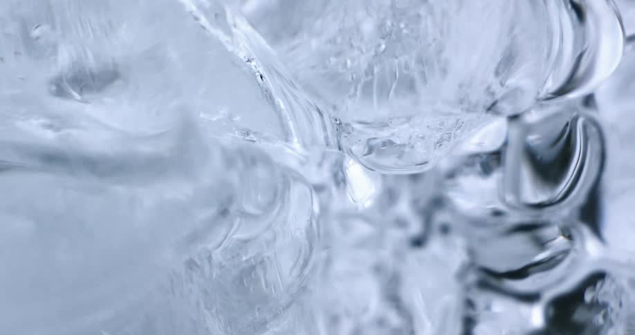A view of water flowing over ice in a river