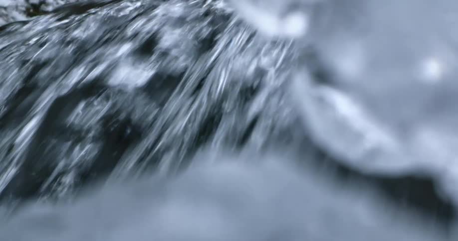 The water falls past the ice