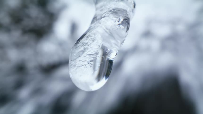 The icicle is slowly dripping water