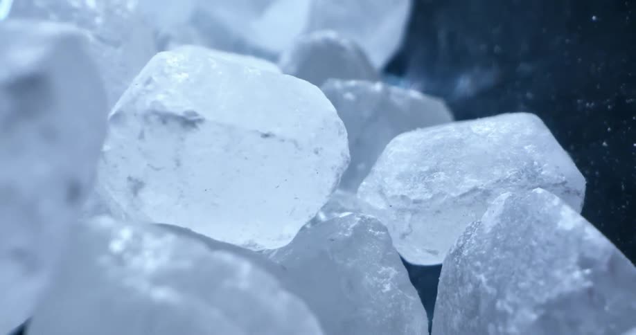 Frozen water is displayed outdoors during the day