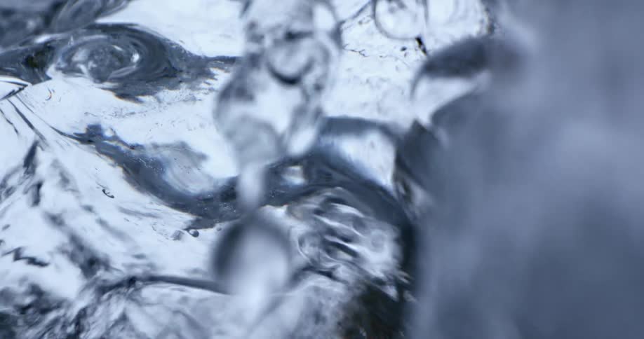 Water flowing over ice outdoors