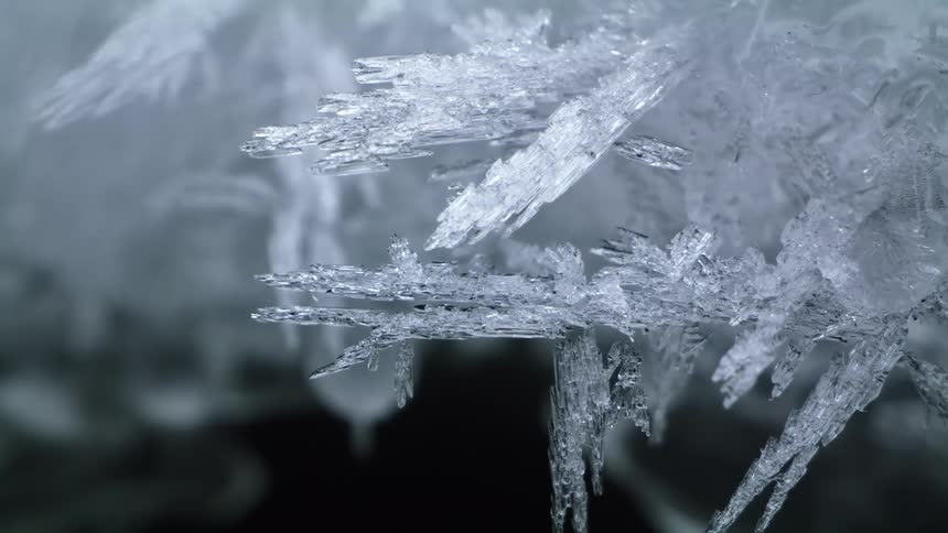 Jagged shards of white ice clustered close together outdoors