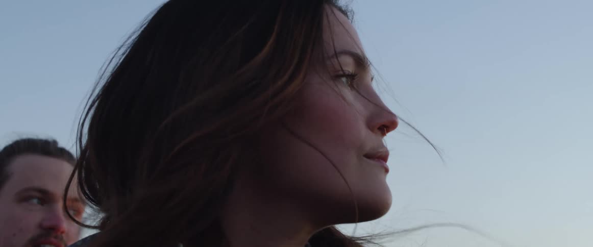 A man and woman looking around
