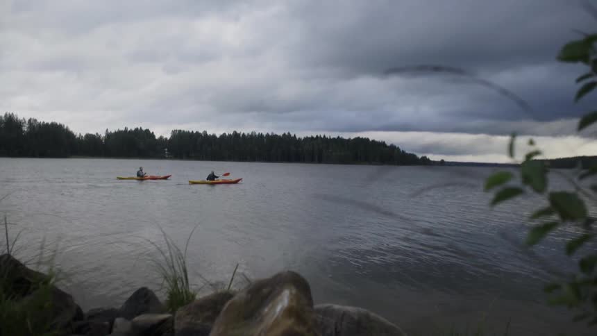 Two boats are being rowed in the lake
