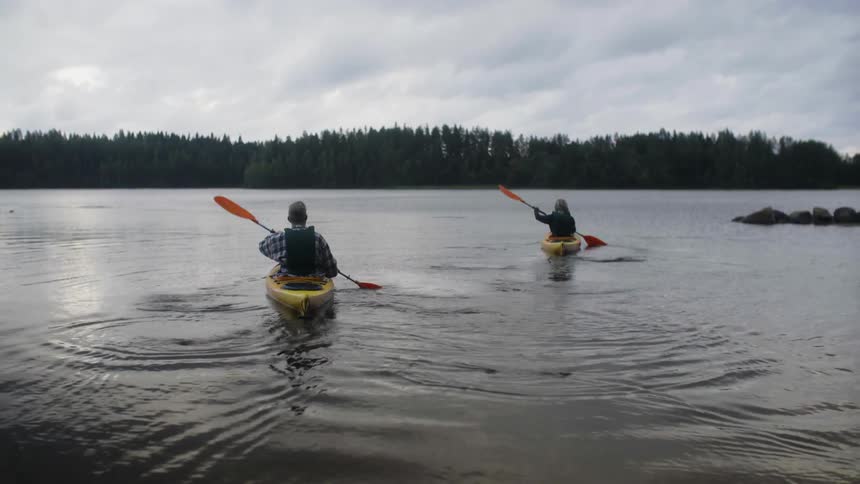 Kayakers paddling across a body of water