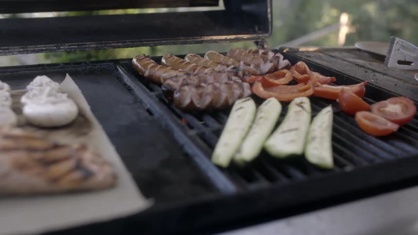 A grill is fully of different food items
