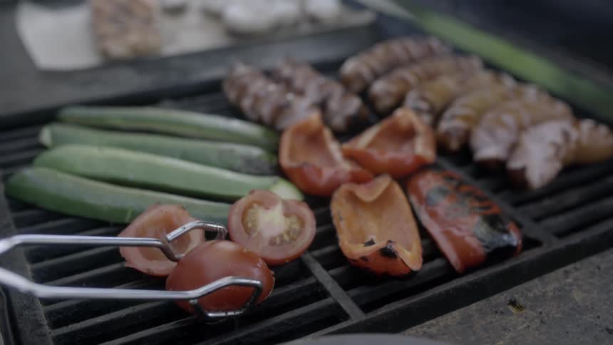 Vegetables being cooked on an outdoor grill