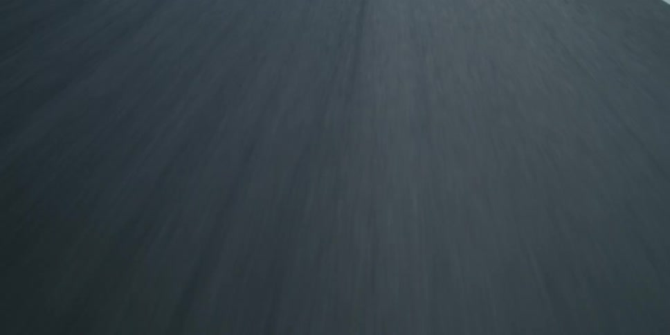 Dark road pavement with white line on the side