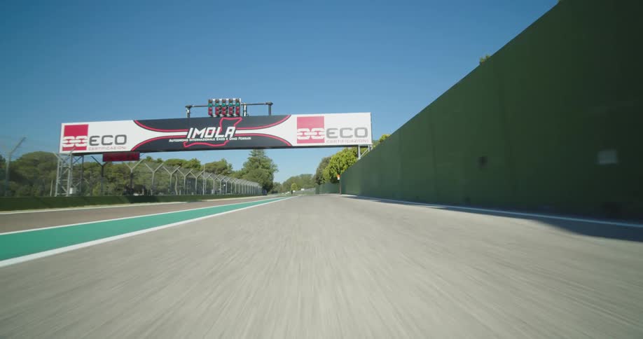 Traveling on a city road merging onto an empty highway on a bright sunny day