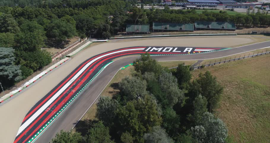 The race track is empty near the city