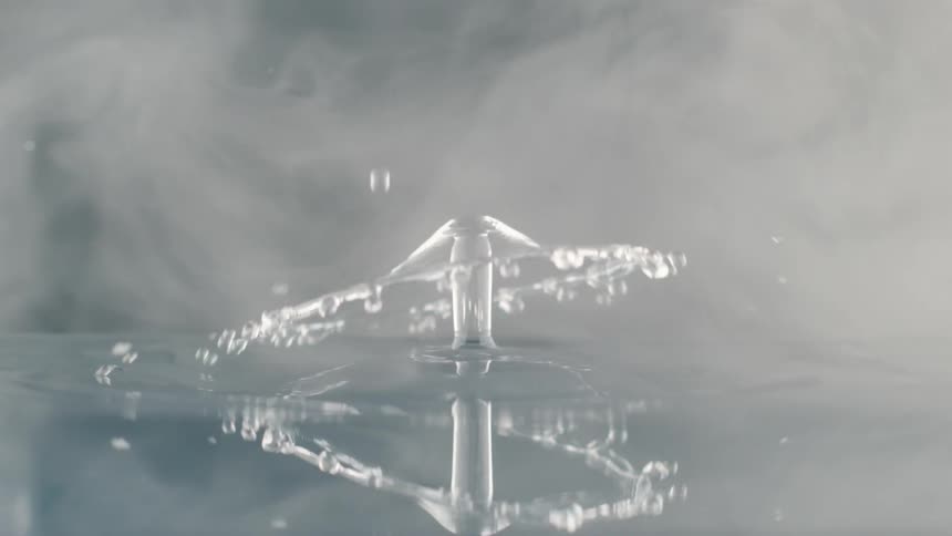 A view of a drop of water falling into water