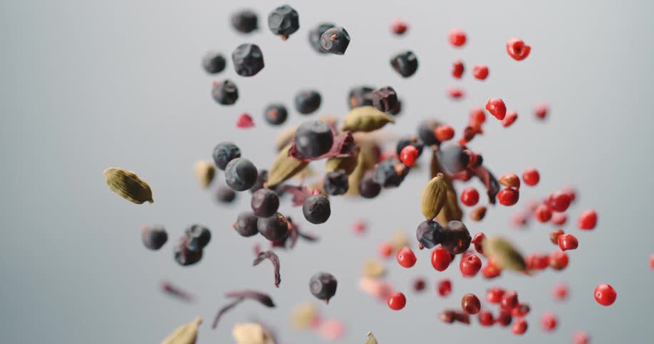 Berries nuts and seeds being thrown in the air during a studio photo shoot