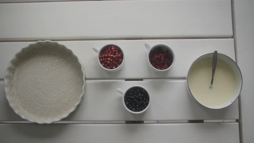 Trays and mugs hold berries and batter