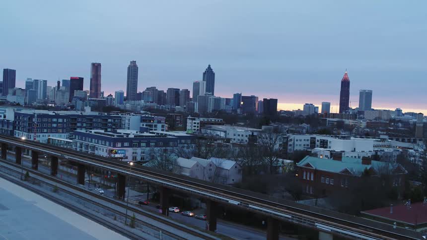 Aerial view of the train tracks near the neigborhood close to the citys downtown at sunset