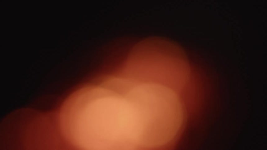 Orange lights are shining outdoors