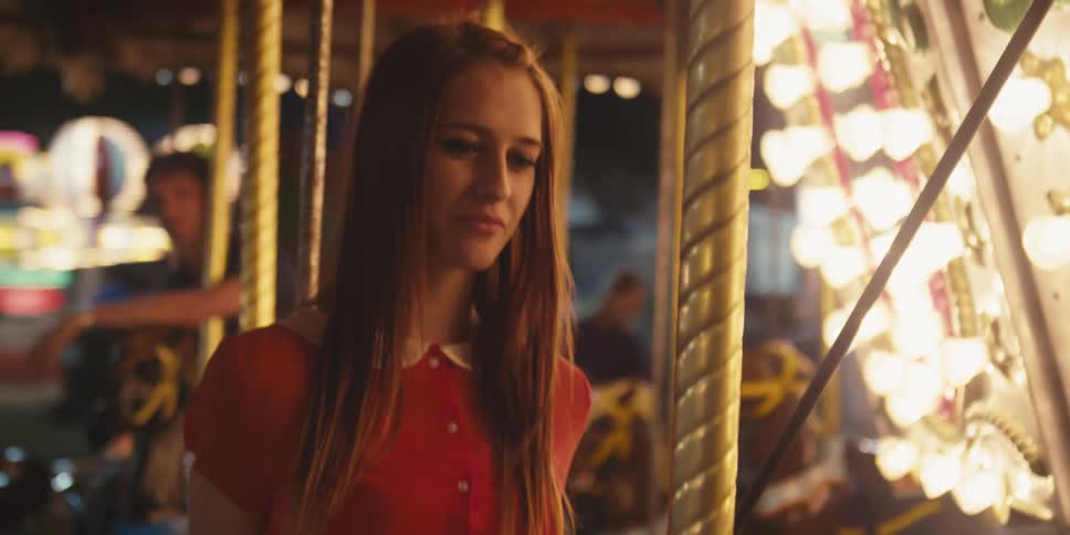 A woman riding a merry go round