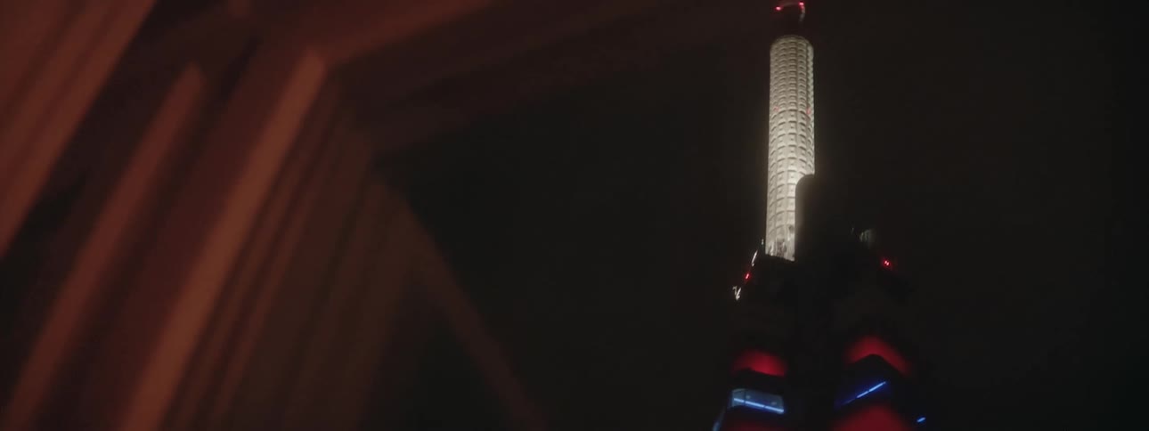 The building is brightly lit at night